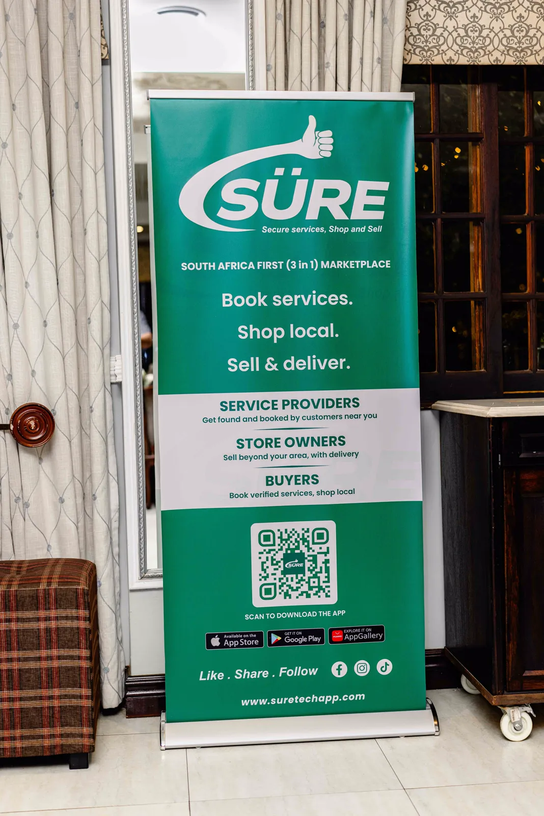 SÜRE branded roll-up banner at the launch event